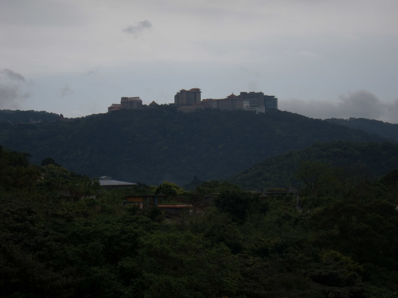 Taiwan-Taipei-Hiking-Yangmingshan - Across the valley on top of another hill is the Chinese cultural university. They seem to be blaring announcements from loudspeakers that carry across