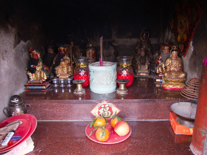Taiwan-Taipei-Hiking-Yangmingshan - Someones been here to light the candles and put the fruit in this thing to frighten away evil spirits. Still it had no effect on me.