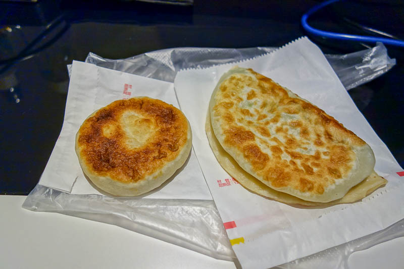 Taiwan-Taipei-Hiking-Yangmingshan - To celebrate, me and my coat returned to the hotel via a grandma on the corner selling pies and pasties. The pie is 'meat' the pasty is leek and tofu.