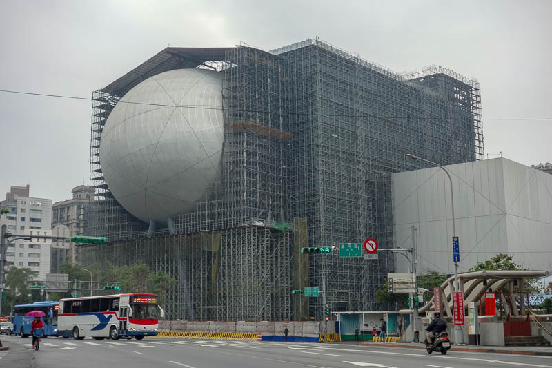 Taiwan-Taipei-Hiking-Yangmingshan - Near the bus stop is this building under construction. Chinese people appreciate the spectacle of a giant windowless orb wedged into the side of a bui